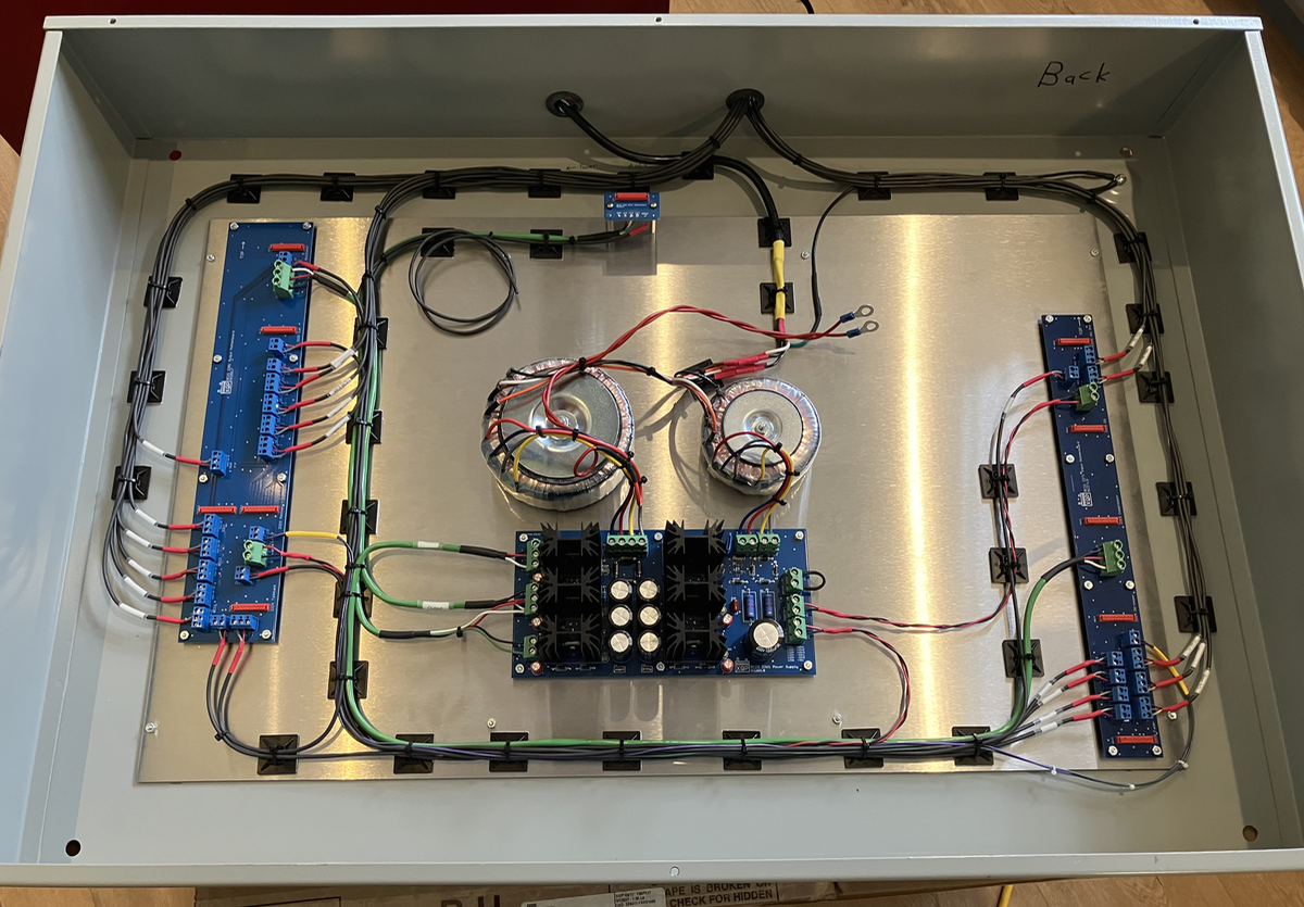 The XQP BC22 internals, minus modules. The power supply is in the center flanked by two motherboards that support the modules on either side.